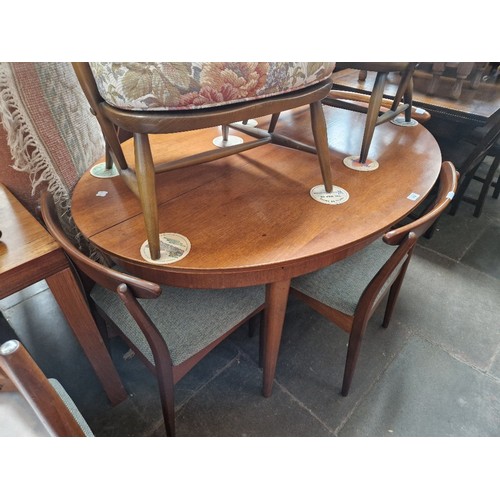 985 - A mid 20th century Greaves & Thomas teak extending dining table and six chairs.