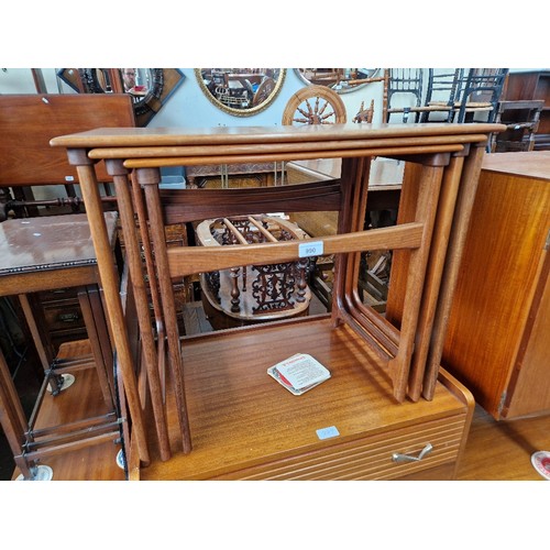 990 - A mid 20th century teak nest of tables.