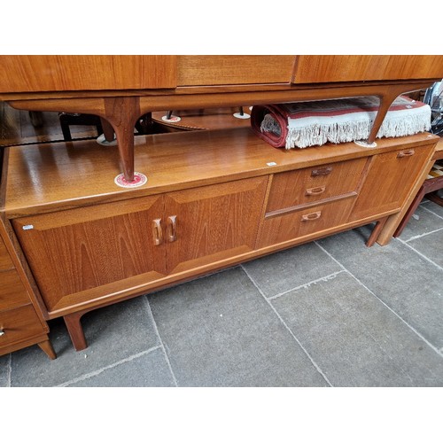 992 - A mid 20th century G Plan teak sideboard, length 206cm.