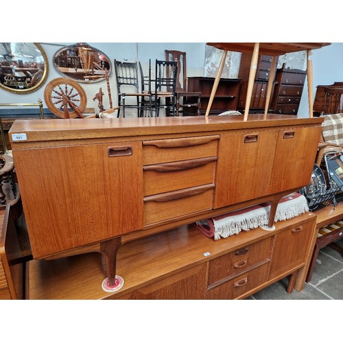 991 - A Mid 20th century teak sideboard, dated 1963, length 176cm.