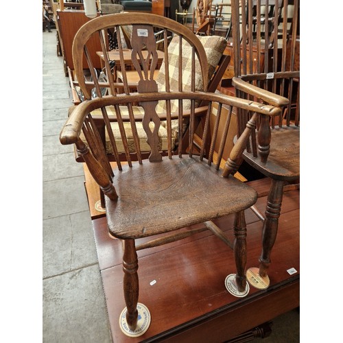 1003 - A 19th century elm Windsor chair.