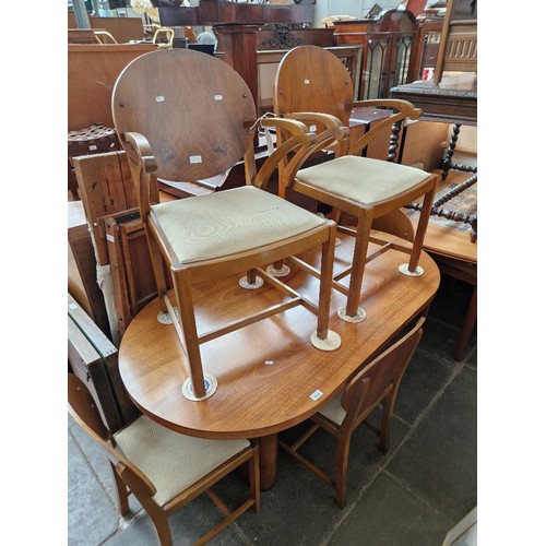 1012 - An Art Deco walnut dining table & six chairs and a matching sideboard.