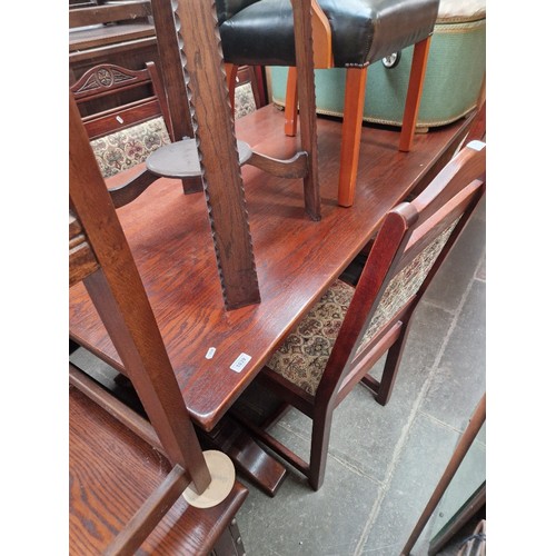 1039 - An Old Charm oak refectory table and four chairs.