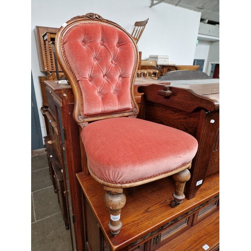 1032 - A late Victorian walnut bedroom chair.