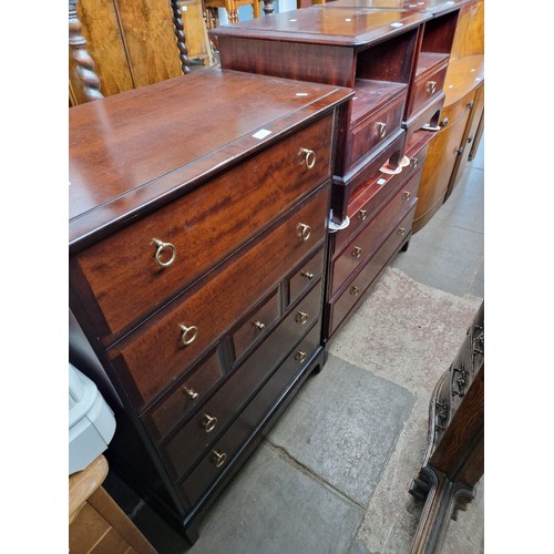 1022 - Stag mahogany bedroom furniture; tallboy chest of drawers, pair of bedside cabinets and a chest of d... 