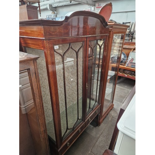 1030 - An Edwardian inlaid mahogany display cabinet.