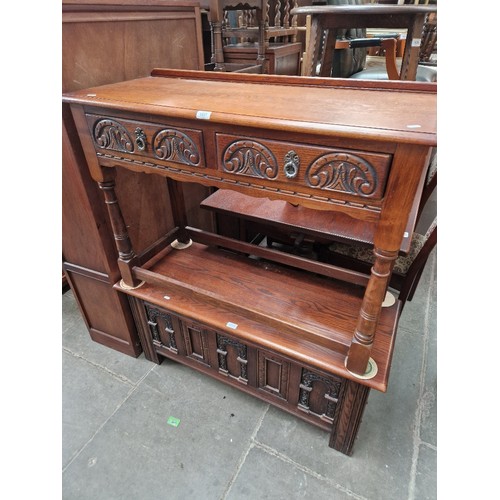 1037 - An oak two drawer side table and a carved oak coffer.