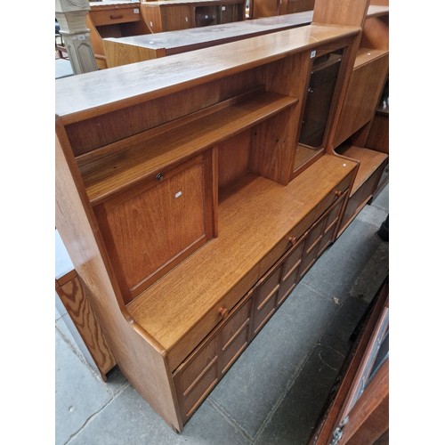 1048 - A Nathan teak highboard, width 153cm together with a stained pine corner cabinet.