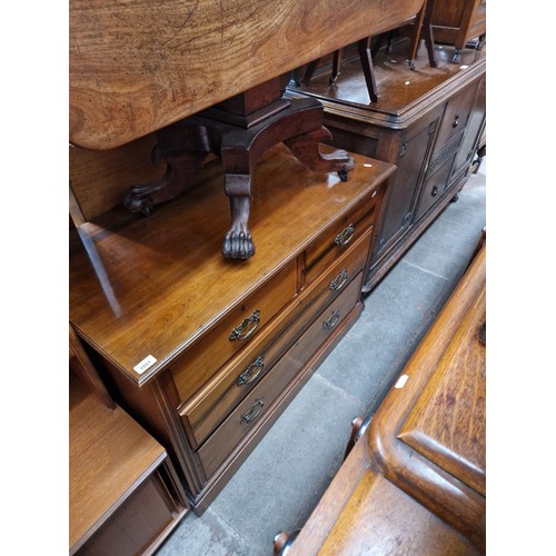 1051 - An Edwardian walnut chest of drawers.