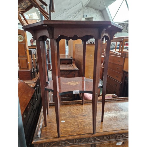 1056 - An Edwardian inlaid mahogany octagonal top occasional table with Moussel Bros label to underside.