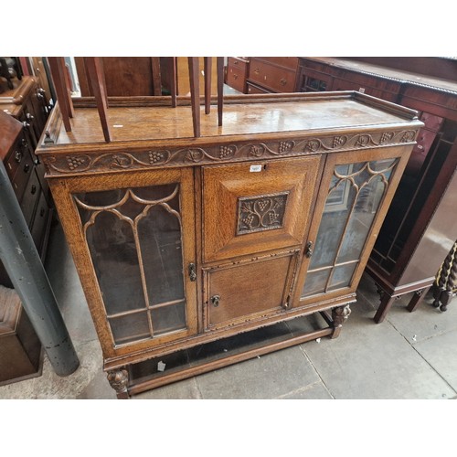 1057 - A 1920s oak bureau display cabinet