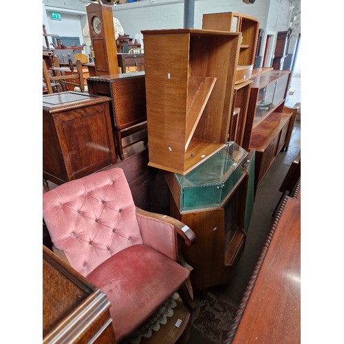 1058 - Various items of furniture to include a mid 20th century display cabinet, a pair of matching bookcas... 