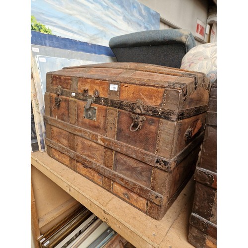 1100 - A vintage dome top travel trunk.