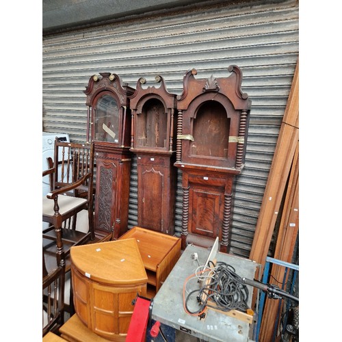 1076 - Three Georgian longcase clock cases; two oak and one mahogany.