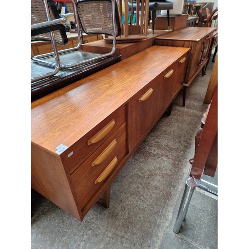 1078 - A mid 20th century Stateroom teak sideboard, height 73cm, width 181cm and depth 42cm.