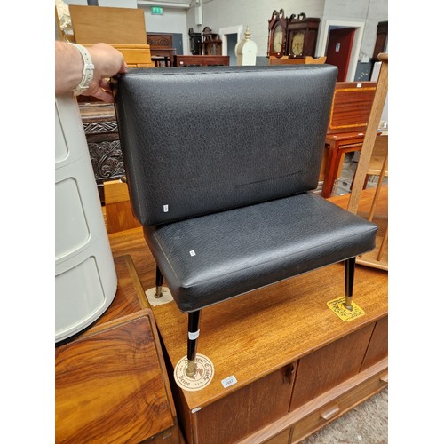 1086 - A pair of mid 20th century black vinyl foot stools