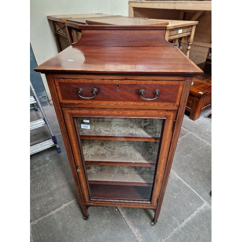 1098 - An Edwardian inlaid mahogany music cabinet