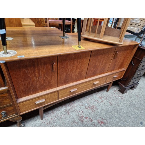 1087 - A mid 20th century G Plan teak sideboard, length 145cm.