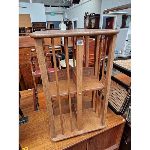 1088 - A mid 20th century Elm revolving bookcase