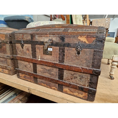 1101 - An early 20th century vintage shipping trunk with labels including E&O Hotel Penang etc.