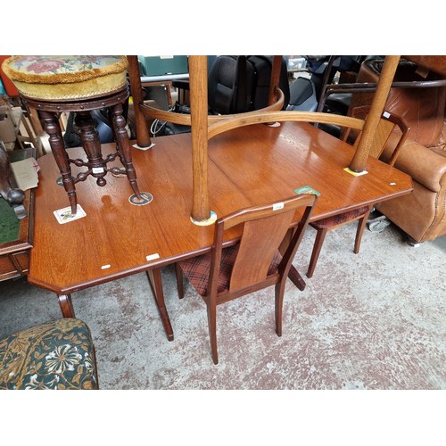 1122 - A mid 20th Century G Plan teak extending dining table and 4 chairs