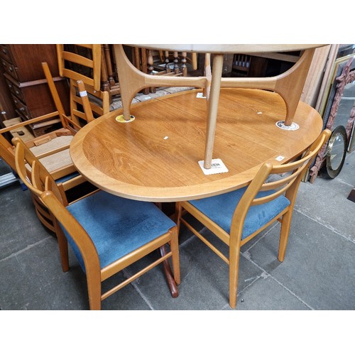 1128 - A Nathan teak extending dining table and six chairs.