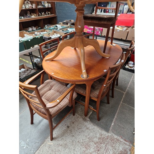 1115 - A mid 20th century McIntosh extending teak dining table and six chairs including two carvers, height... 