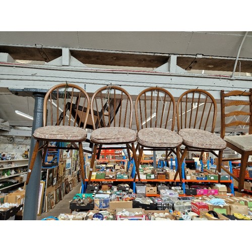 1124 - A set of four Ercol beech and elm 'Windsor' dining chairs.