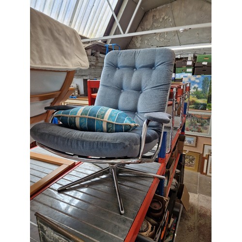 1131 - A mid 20th century chrome swivel armchair.