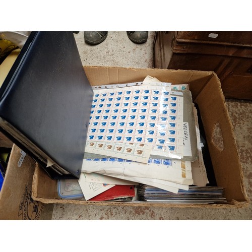 433 - A box of assorted stamp albums, covers and loose stamps.