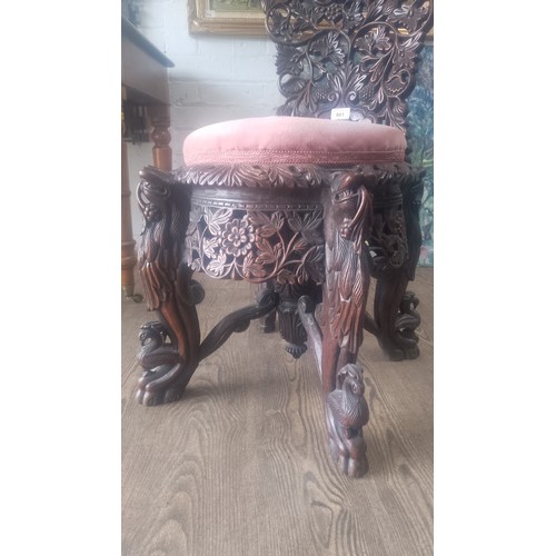 961 - A 19th century Anglo Indian carved rosewood chair, the legs modelled as stylised lions, the back car... 