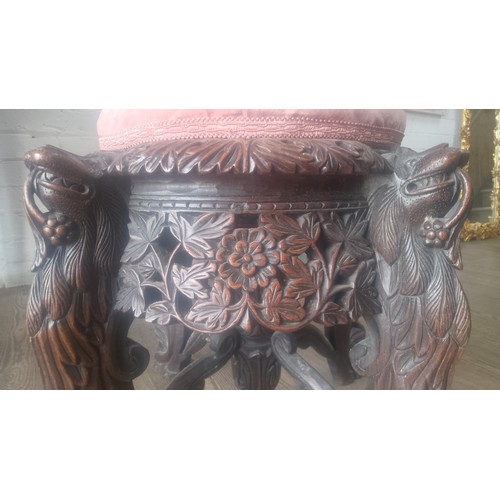 961 - A 19th century Anglo Indian carved rosewood chair, the legs modelled as stylised lions, the back car... 