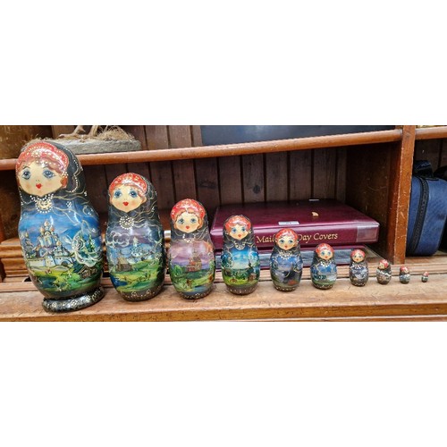 57 - A collection of Russian dolls, some being from the Semenov factory circa 1970s and one hand painted ... 