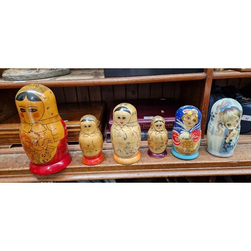 57 - A collection of Russian dolls, some being from the Semenov factory circa 1970s and one hand painted ... 