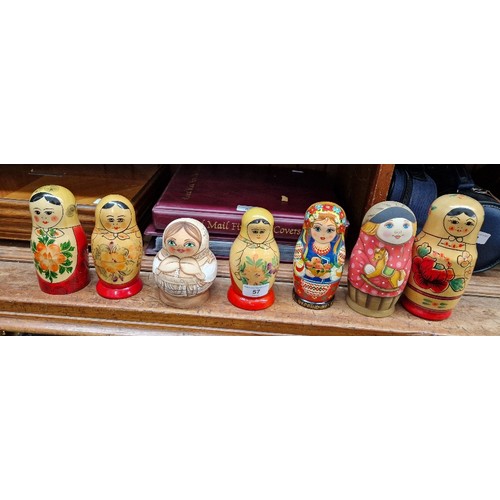 57 - A collection of Russian dolls, some being from the Semenov factory circa 1970s and one hand painted ... 