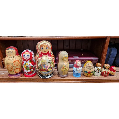 57 - A collection of Russian dolls, some being from the Semenov factory circa 1970s and one hand painted ... 