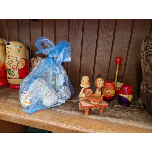 57 - A collection of Russian dolls, some being from the Semenov factory circa 1970s and one hand painted ... 