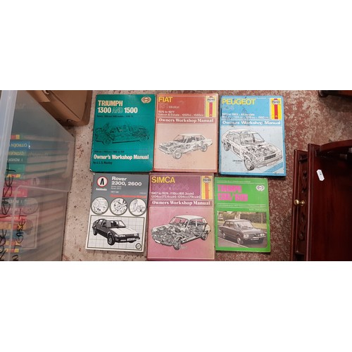 294 - Two boxes of Haynes manuals.