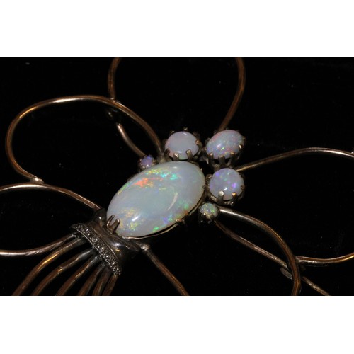 9 - An early 20th century gold wire opal and diamond brooch,  bouquet form with central cluster of opals... 