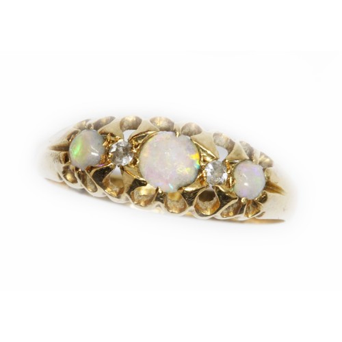 63 - An opal cabochon and diamond ring, hallmarked rubbed, gross weight 1.6g, size L.