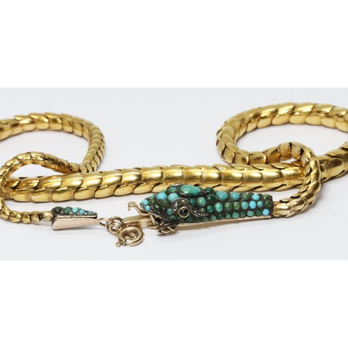 1 - A Victorian serpentine necklace, circa 1860, the snake head set with turquoise cabochons, one ruby a... 