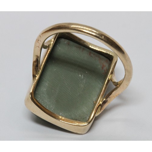 7 - A green lava cameo ring, the cameo depicting a classical female bust in side profile, 12mm x 18mm, y... 