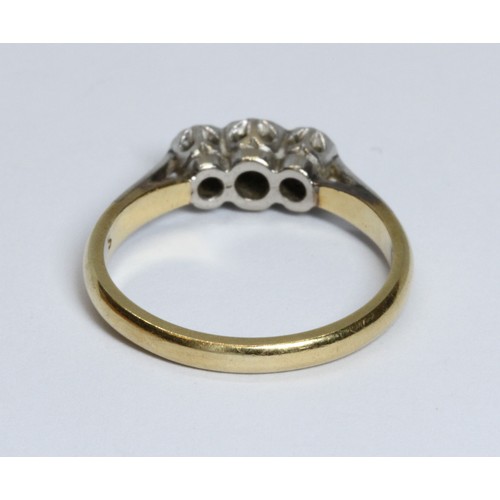 64 - A three stone diamond ring, band marked '18ct', gross weight 2.9g, size L.