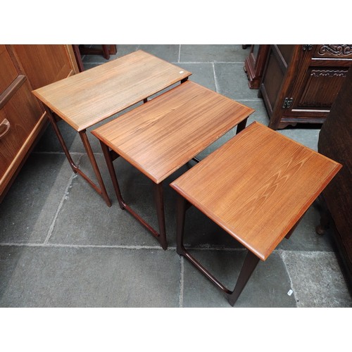 990 - A mid 20th century teak nest of tables.