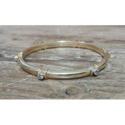 459 - A bangle marked '585', diameter 60mm, gross weight 12g.