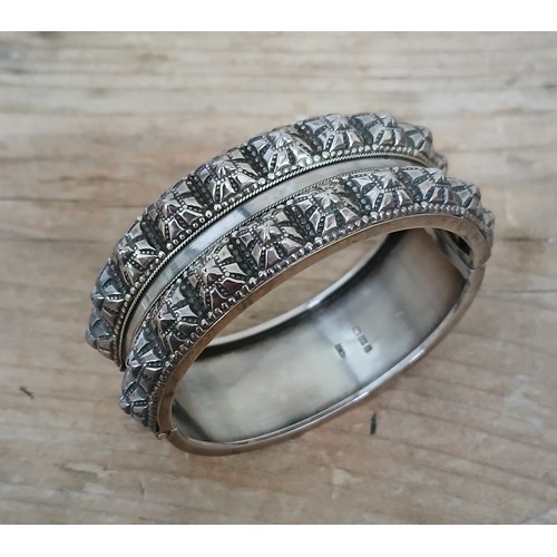 444 - A hallmarked silver bangle.