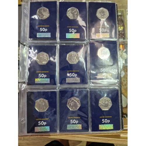 420 - A file of assorted collectable coins in change checker cards comprising of 43 x 50ps (2 x Gruffalo, ... 