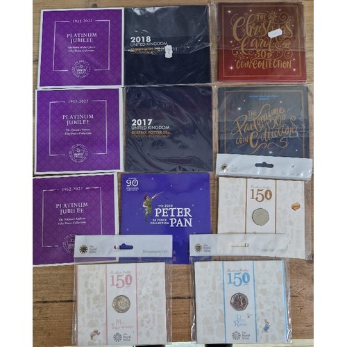 422 - A box of assorted BUNC 50p coins & sets comprising of 3 x Platinum Jubilee sets, 2020 Peter Pan set,... 