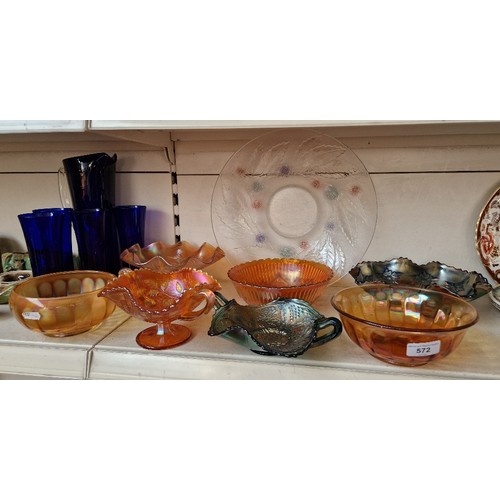 572 - 7 carnival glass items, a 5 piece blue glass lemonade set and a glass bowl decorated with a sweet ch... 