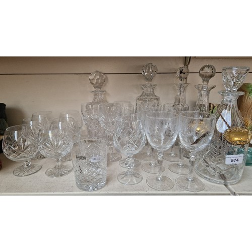 574 - 5 lead crystal decanters, 3 decanter labels and 20 drinking glasses including wine, brandy and tumbl... 